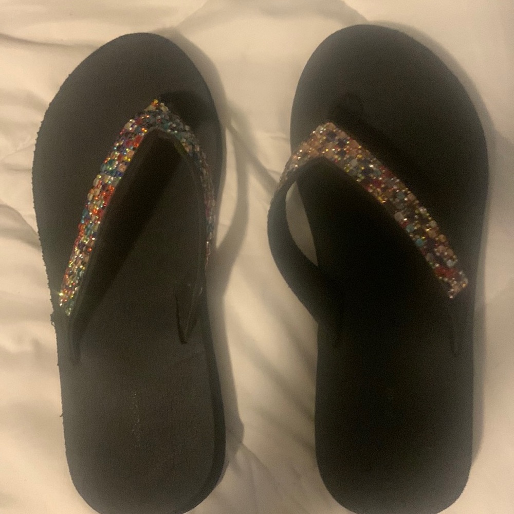 Black sparkly flip flops